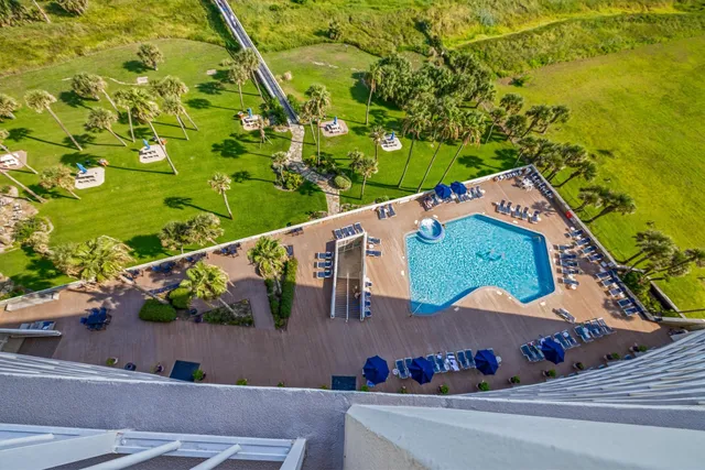 an aerial view of a house with a garden