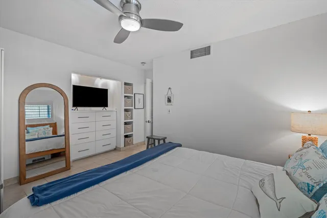 a bedroom with a bed and a dresser