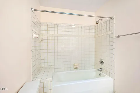 a bathroom with a shower and a bathtub