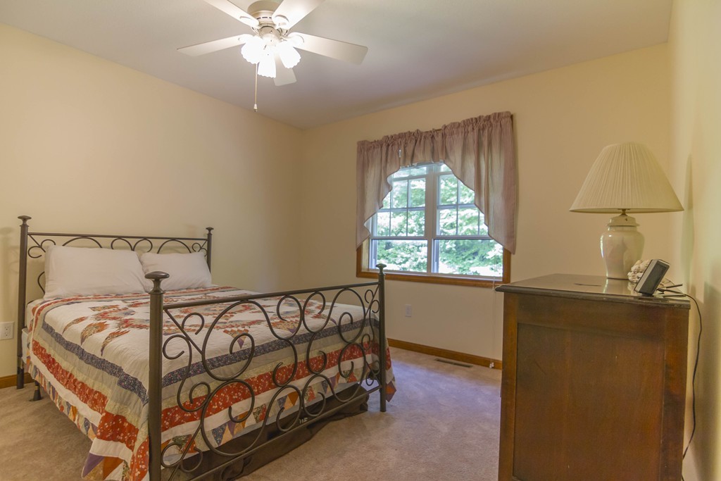 139 Rice Corner Road Brookfield, MA 01506 - Photo 11 of 24 a bed sitting in a bedroom next to a window