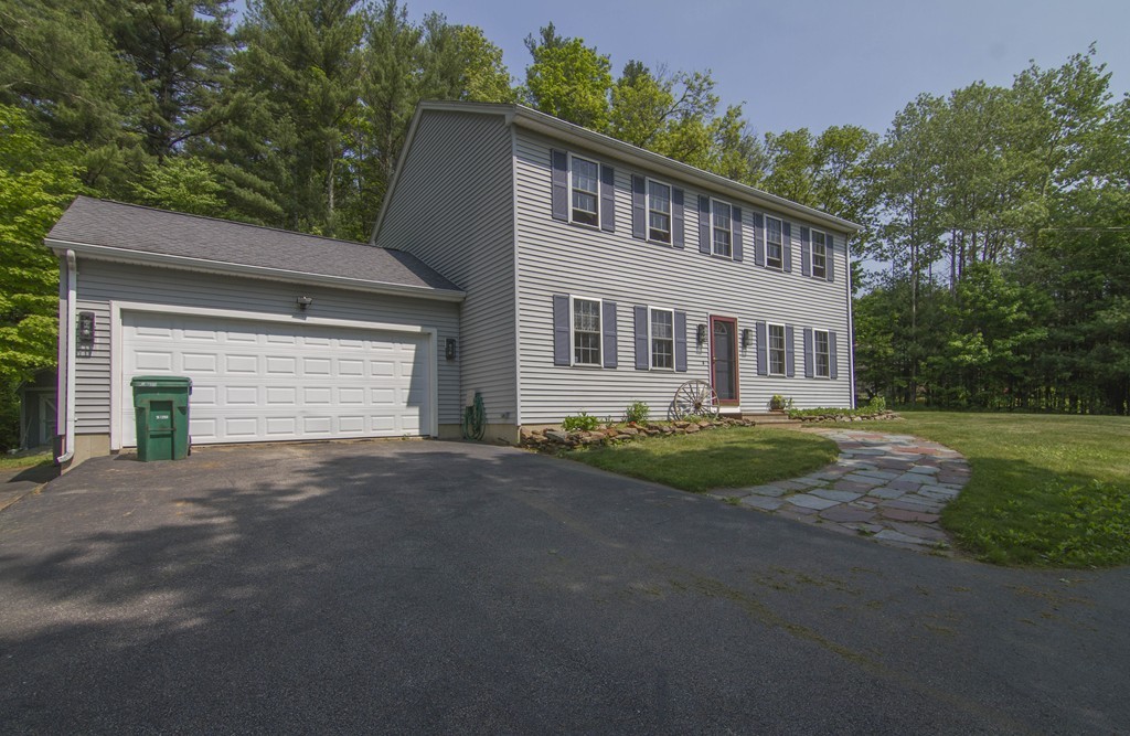 139 Rice Corner Road Brookfield, MA 01506 - Photo 21 of 24 a front view of a house with garden