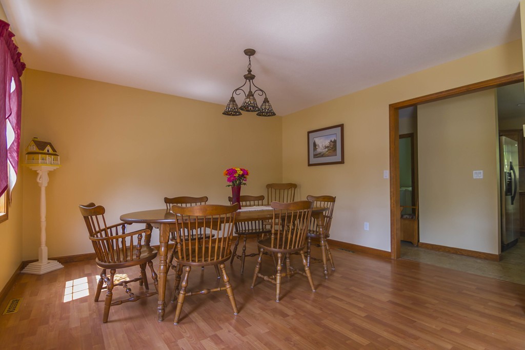139 Rice Corner Road Brookfield, MA 01506 - Photo 6 of 24 a view of a dining room with furniture and wooden floor