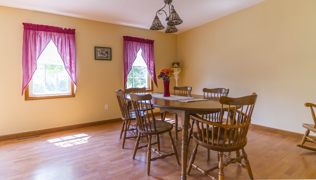 139 Rice Corner Road Brookfield, MA 01506 - Photo 7 of 24 a view of a dining room with furniture and window
