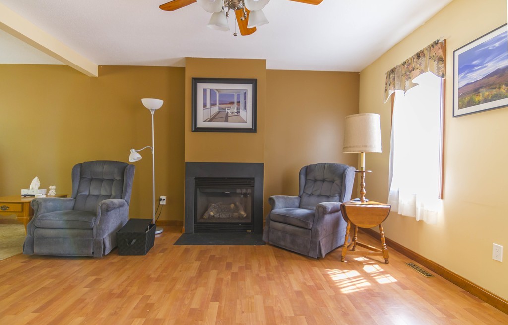 139 Rice Corner Road Brookfield, MA 01506 - Photo 8 of 24 a living room with furniture and a fireplace