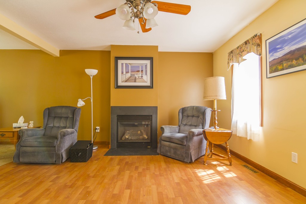 139 Rice Corner Road Brookfield, MA 01506 - Photo 9 of 24 a bedroom with furniture and a fireplace