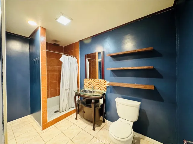 a bathroom with a sink a toilet and bathtub