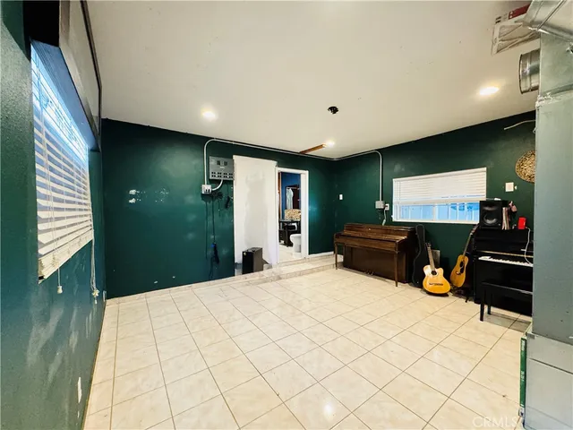 a bathroom with a toilet a sink and a shower