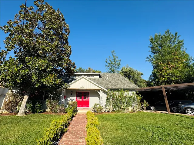 a front view of a house with yard