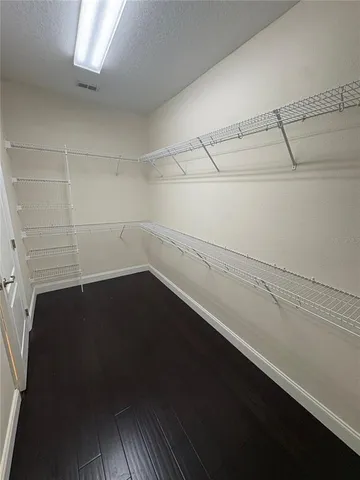 a view of a room with racks on the wall