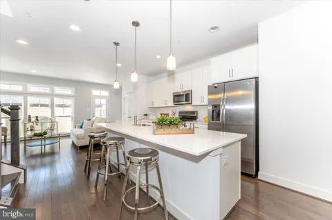 a view of dining room with furniture and a potted plant