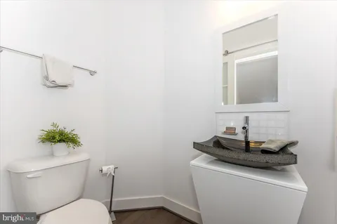 a bathroom with a double vanity sink mirror and shower