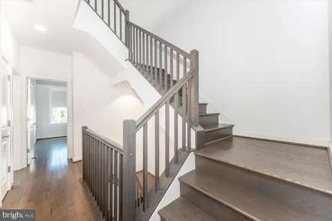 a bathroom with a toilet a sink and a window