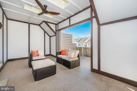 a view of a blue house with a yard