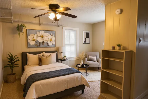 a bedroom with a bed and a chandelier