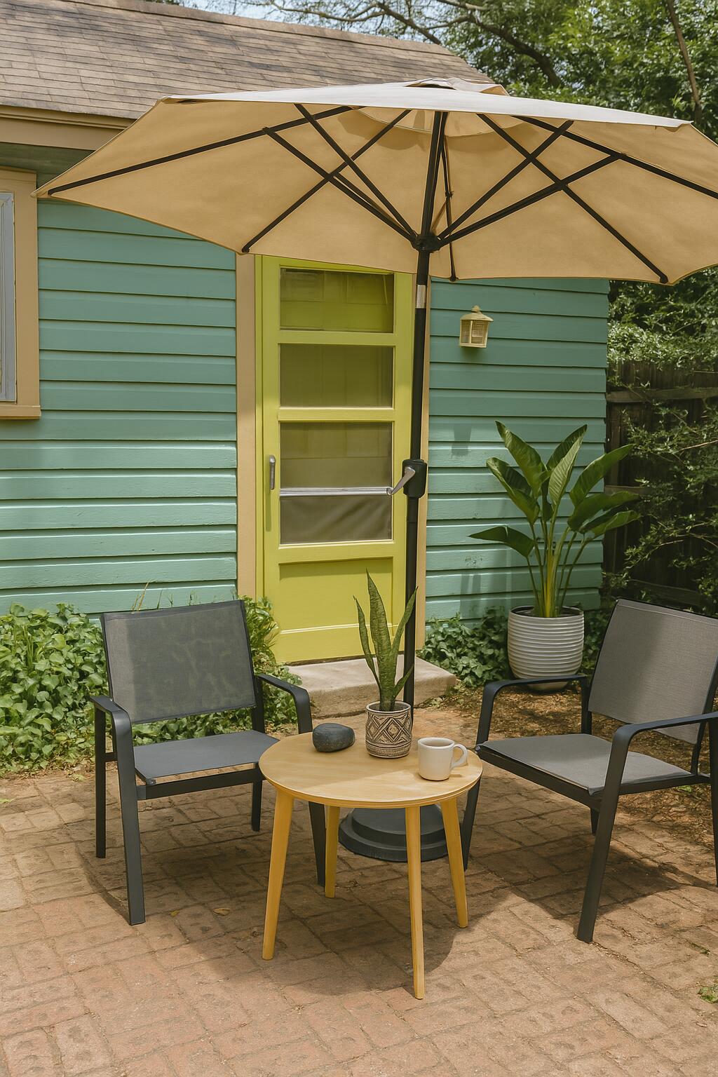 2432 22nd Street, Unit R Lubbock, TX 79411 - Photo 4 of 6 a view of a chairs and table in the back yard of the house