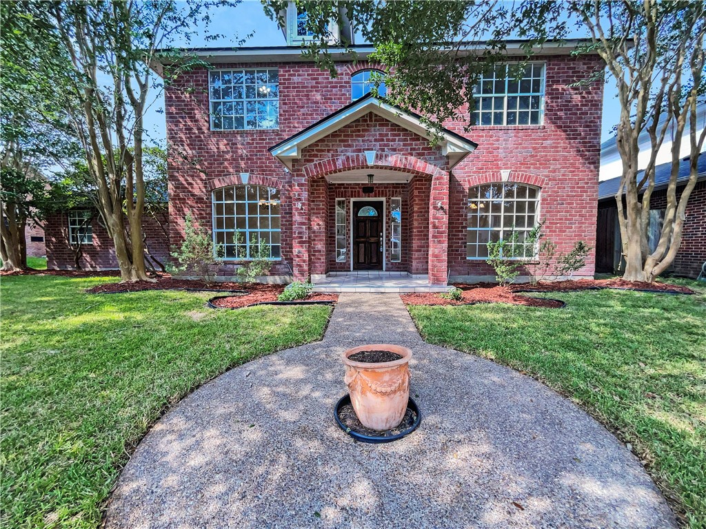 4337 Lake Apache Drive Corpus Christi, TX 78413 - Photo 1 of 1 a front view of a house with garden and porch