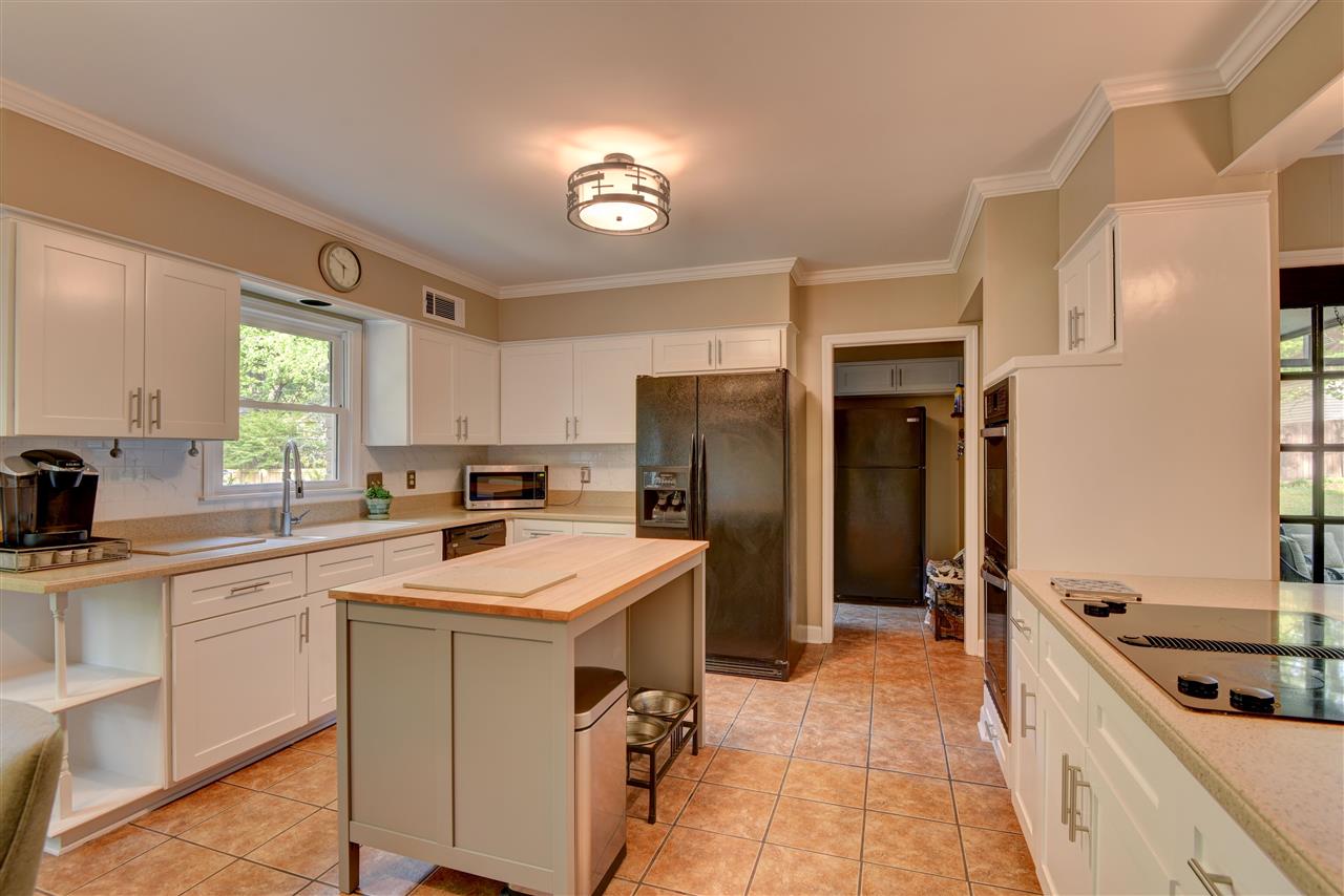2290 Massey Road Memphis, TN 38119 - Photo 24 of 25 Butcher block Island and breakfast area make for functionality in this open kitchen/great room floor plan