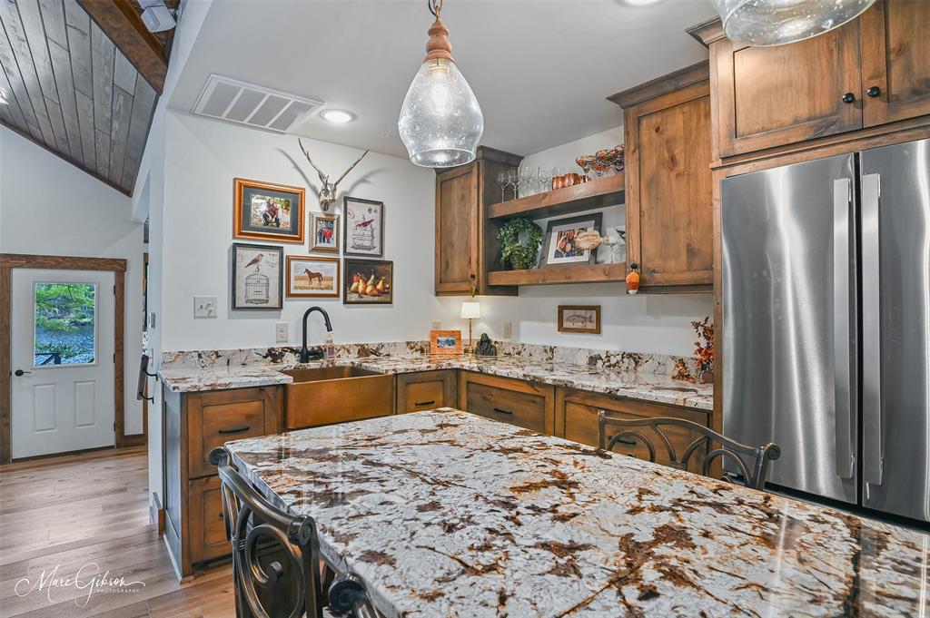 335 Coleman Loop Homer, LA 71040 - Photo 13 of 40 a kitchen with stainless steel appliances granite countertop a sink stove and refrigerator