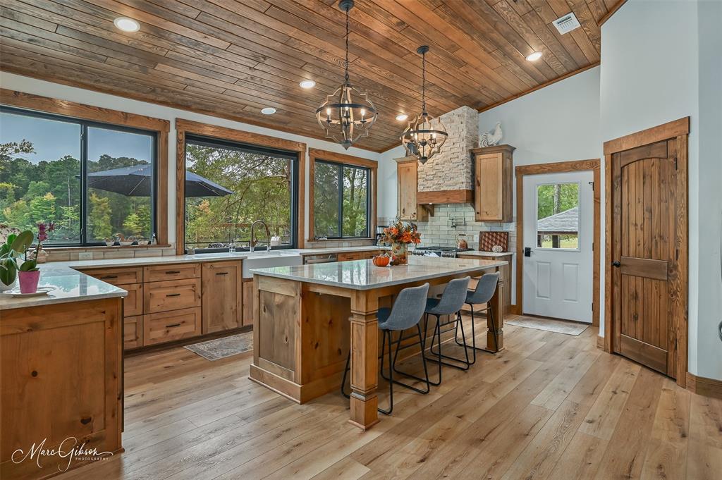 335 Coleman Loop Homer, LA 71040 - Photo 14 of 40 a kitchen with a table chairs and wooden floor