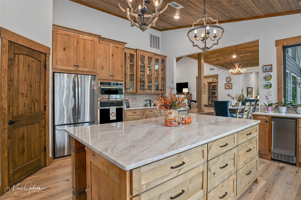 335 Coleman Loop Homer, LA 71040 - Photo 16 of 40 a kitchen with stainless steel appliances granite countertop a sink refrigerator and cabinets