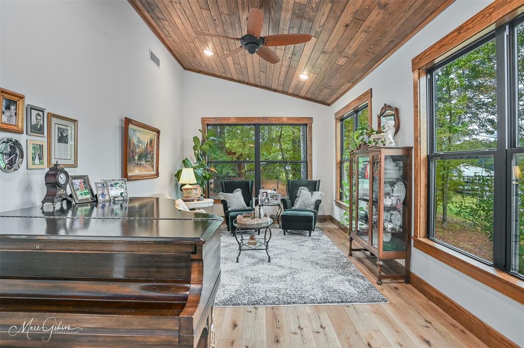 335 Coleman Loop Homer, LA 71040 - Photo 20 of 40 a living room with large windows and wooden floor
