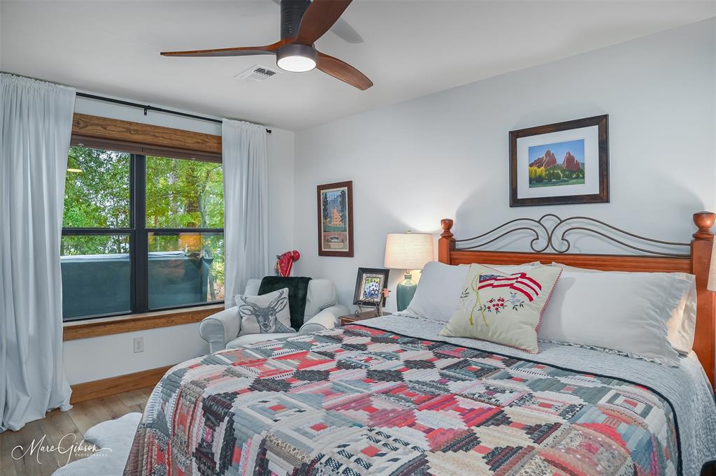 335 Coleman Loop Homer, LA 71040 - Photo 25 of 40 a bedroom with a bed and a painting on the wall