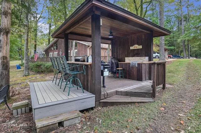a view of a patio with a table chairs and backyard