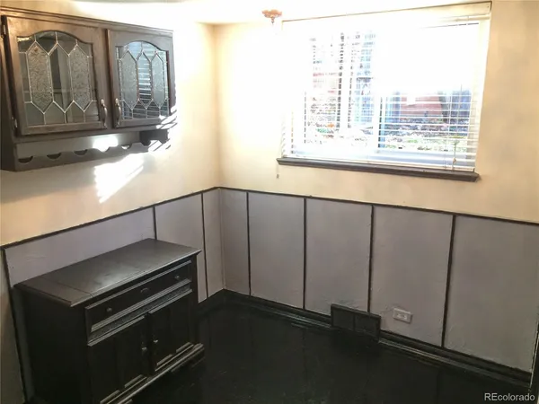 a view of hallway with a bathroom
