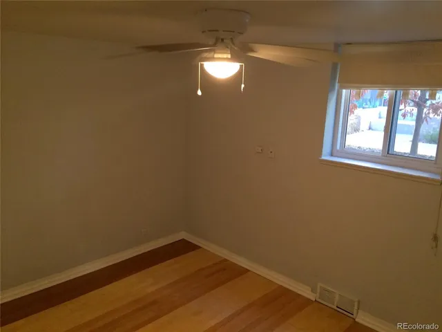 a view of a bathroom with a shower and a mirror