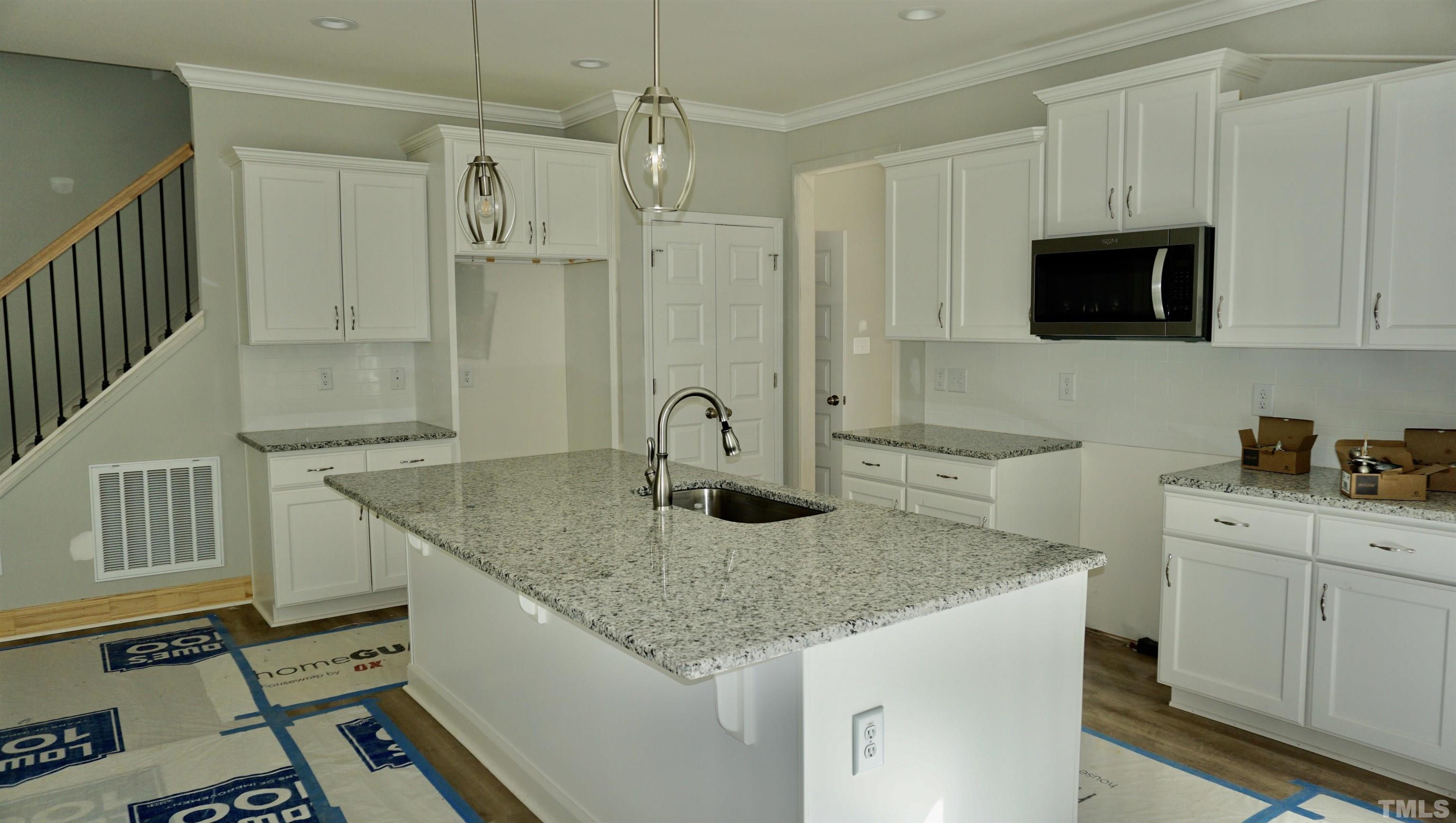 832 Mulberry Road Spring Hope, NC 27882 - Photo 12 of 26 a kitchen with sink cabinets and stove