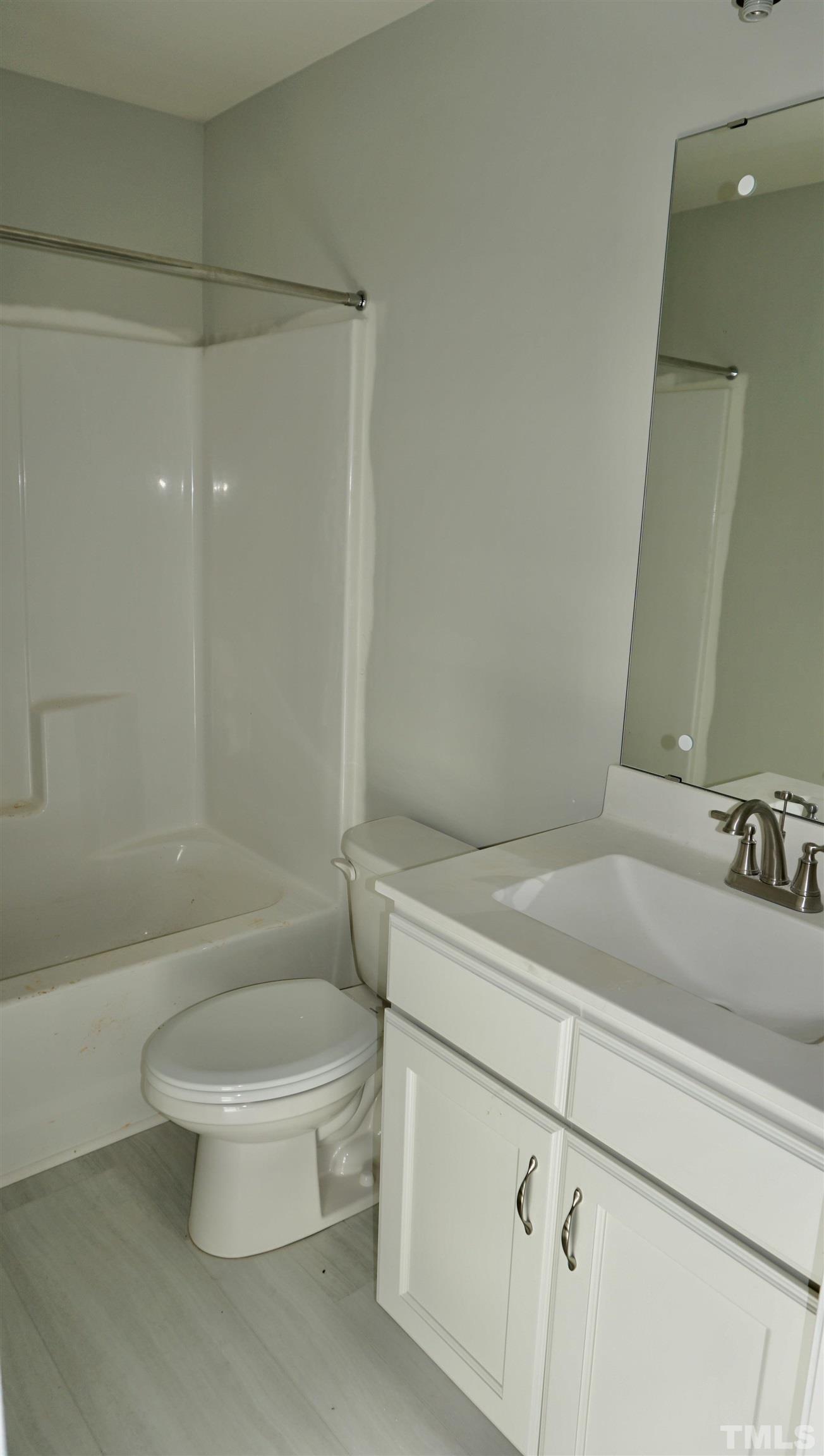 832 Mulberry Road Spring Hope, NC 27882 - Photo 13 of 26 a bathroom with a sink a toilet and shower