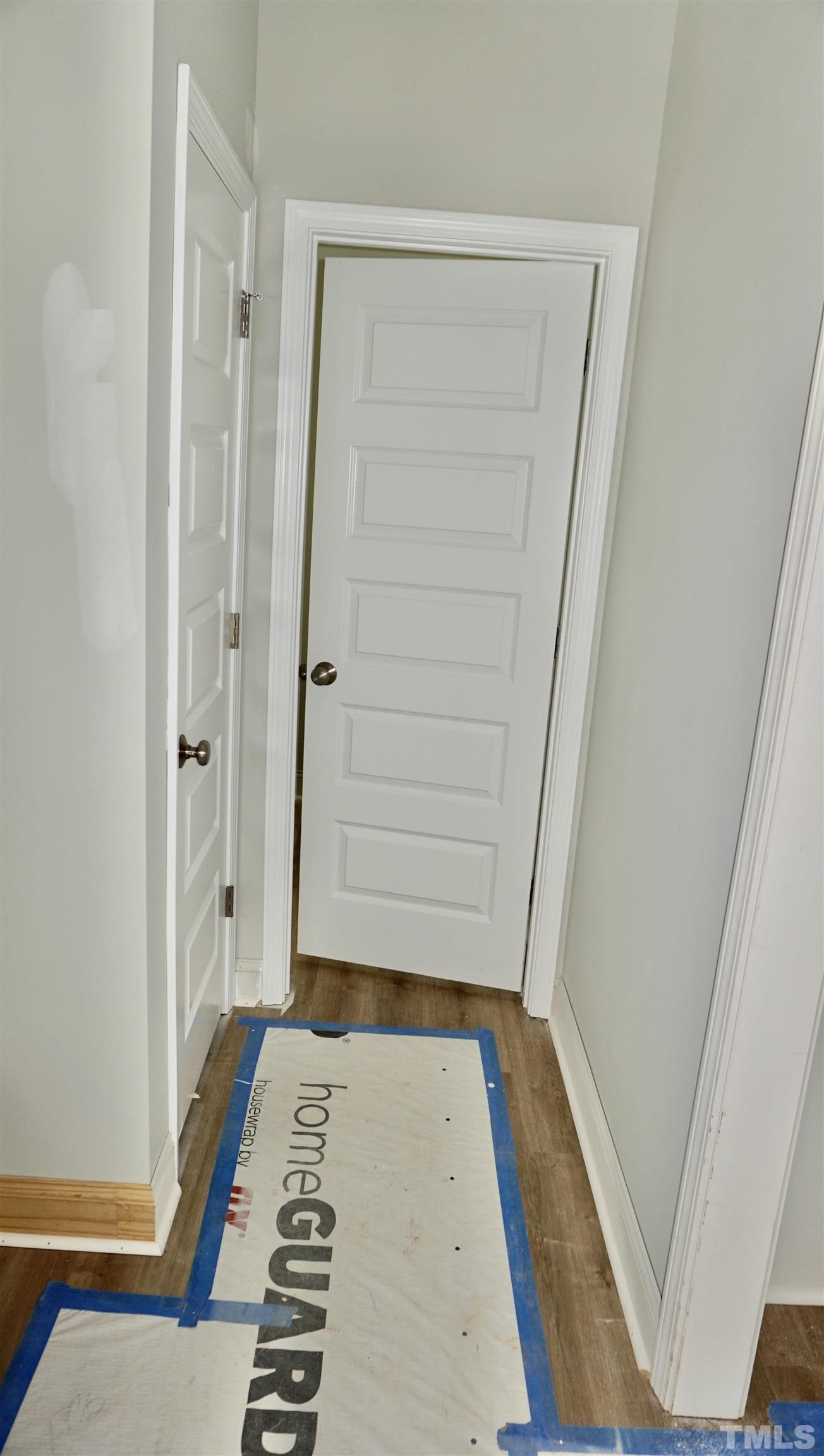 832 Mulberry Road Spring Hope, NC 27882 - Photo 15 of 26 a view of bedroom with wooden floor and white walls