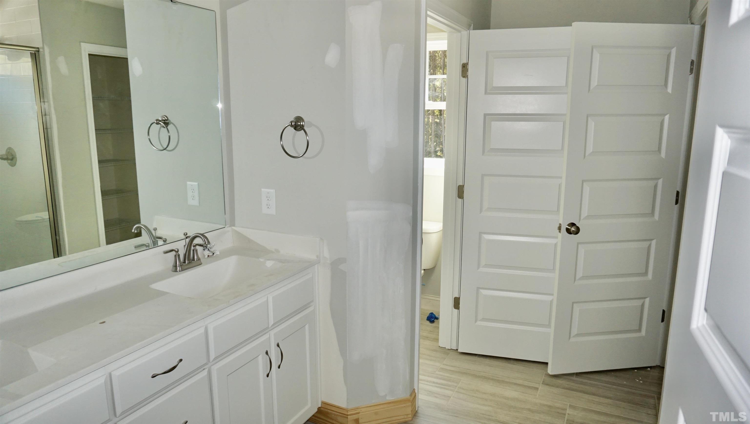 832 Mulberry Road Spring Hope, NC 27882 - Photo 17 of 26 a bathroom with a shower and a sink