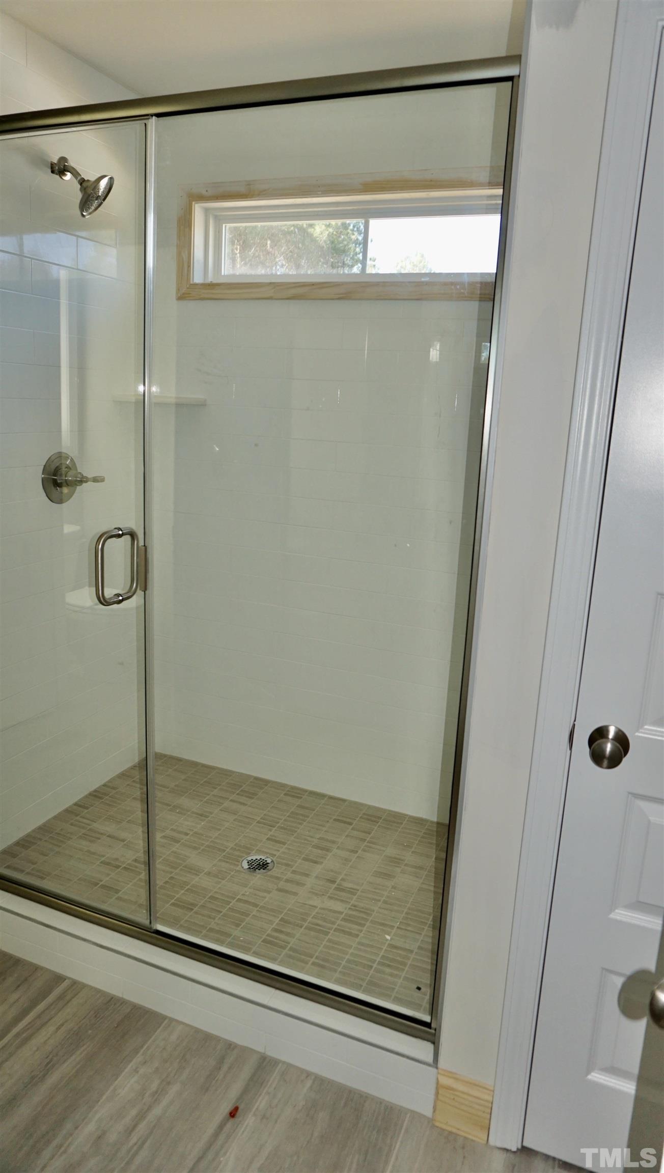 832 Mulberry Road Spring Hope, NC 27882 - Photo 20 of 26 a bathroom with a glass shower door