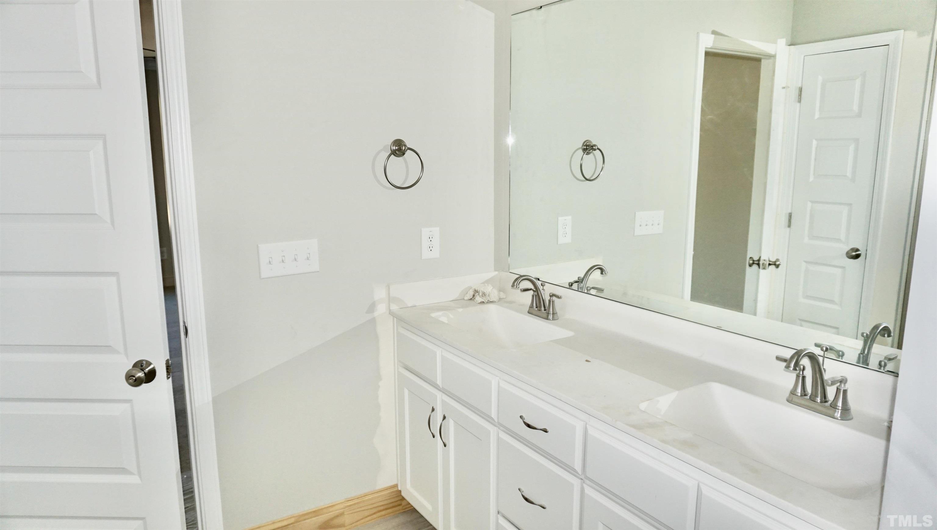 832 Mulberry Road Spring Hope, NC 27882 - Photo 21 of 26 a bathroom with double vanity sink and a mirror