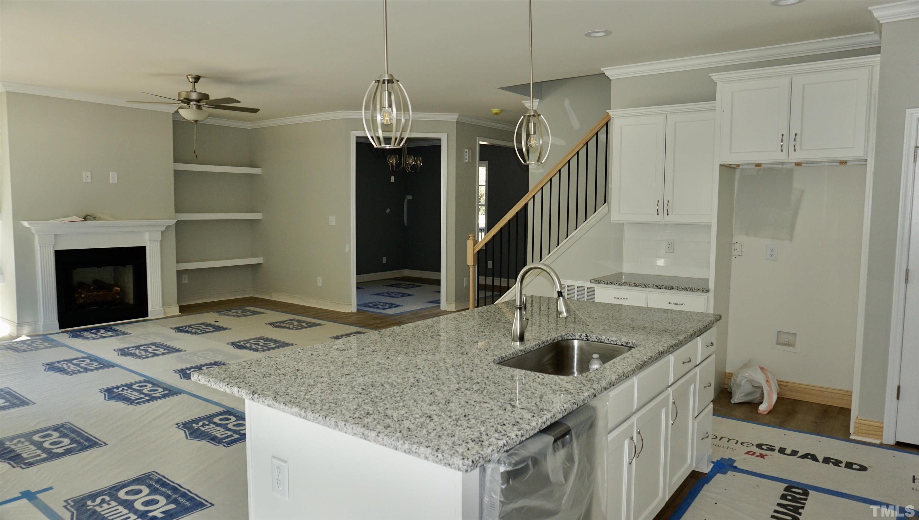 832 Mulberry Road Spring Hope, NC 27882 - Photo 26 of 26 a kitchen with a sink a stove and a refrigerator