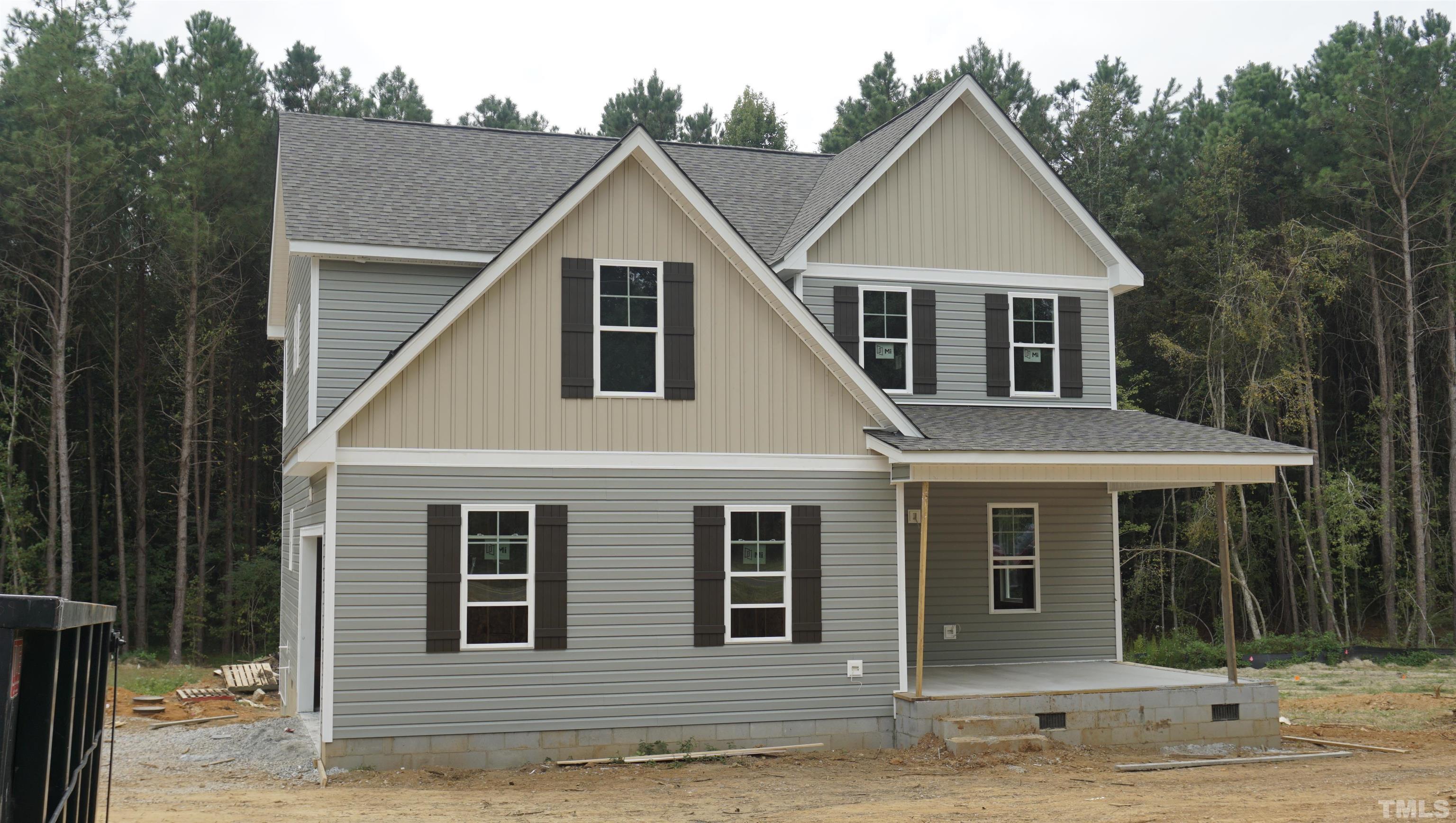 832 Mulberry Road Spring Hope, NC 27882 - Photo 3 of 26 a front view of a house with garden