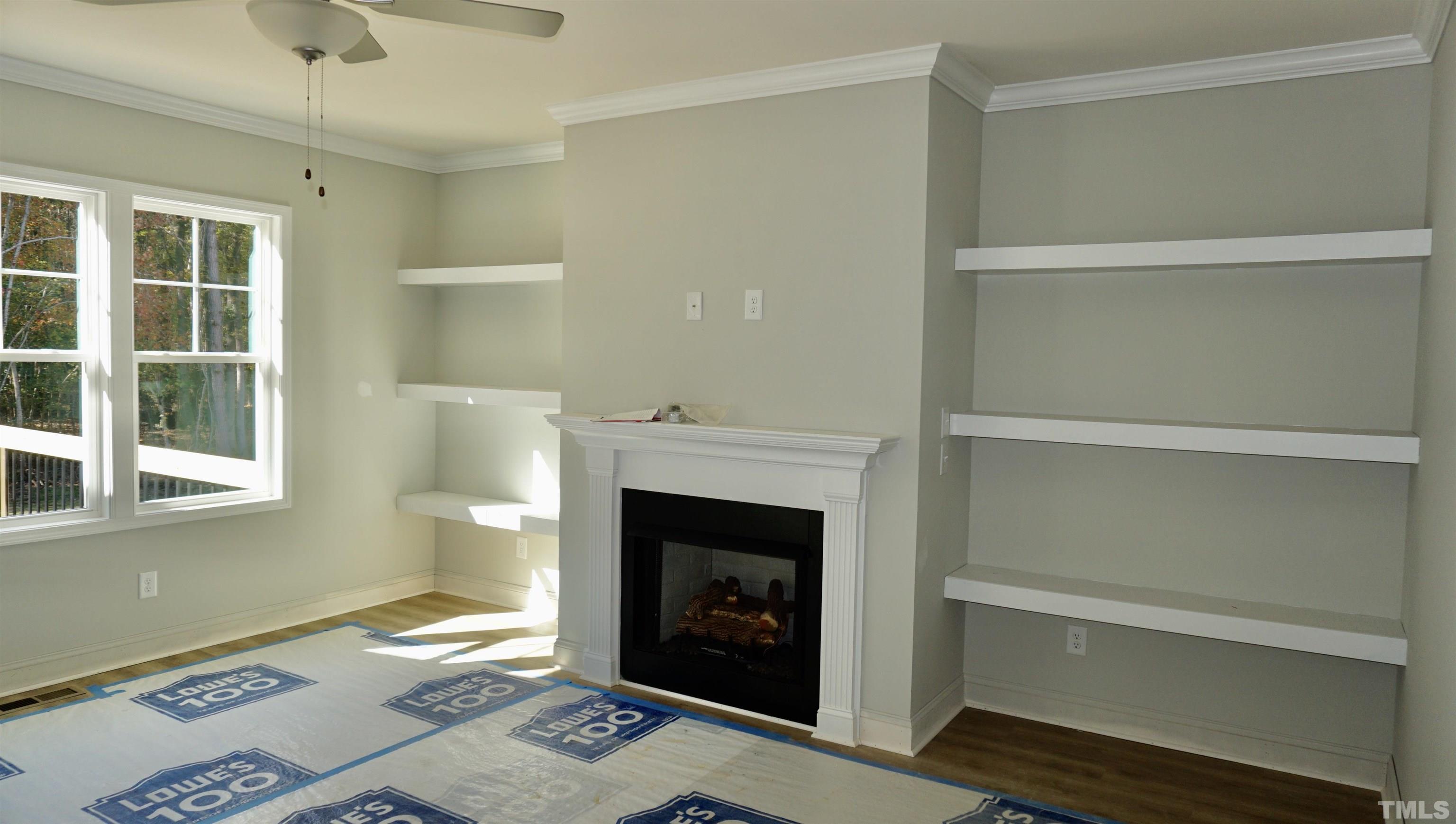 832 Mulberry Road Spring Hope, NC 27882 - Photo 7 of 26 a living room with furniture and a fireplace