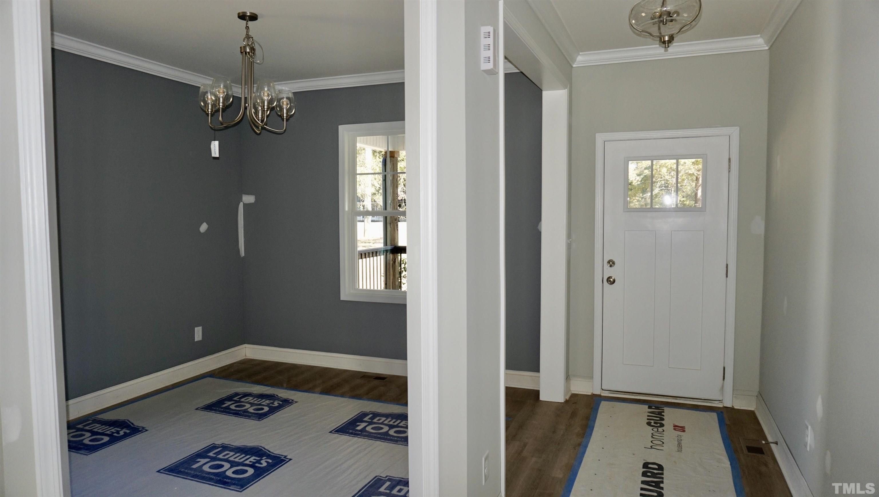 832 Mulberry Road Spring Hope, NC 27882 - Photo 8 of 26 a view of livingroom with hardwood floor and kitchen view