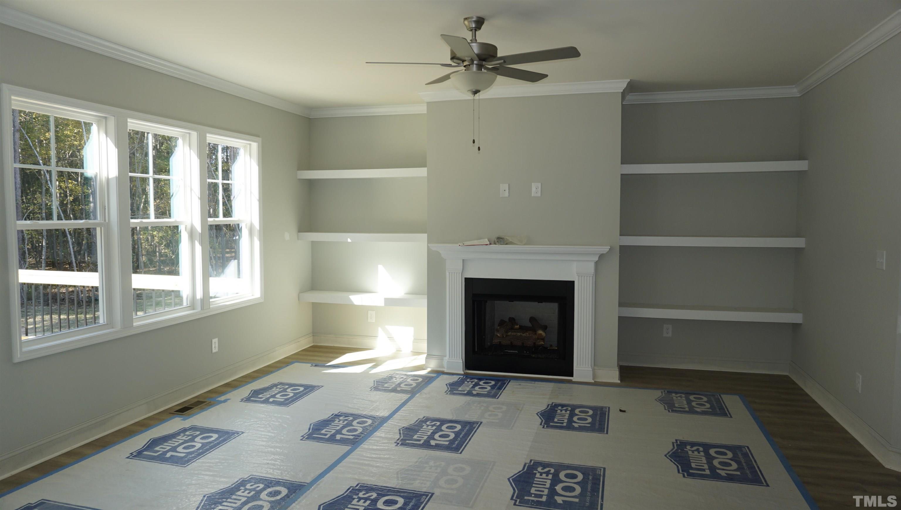 832 Mulberry Road Spring Hope, NC 27882 - Photo 9 of 26 a living room with furniture and a fireplace