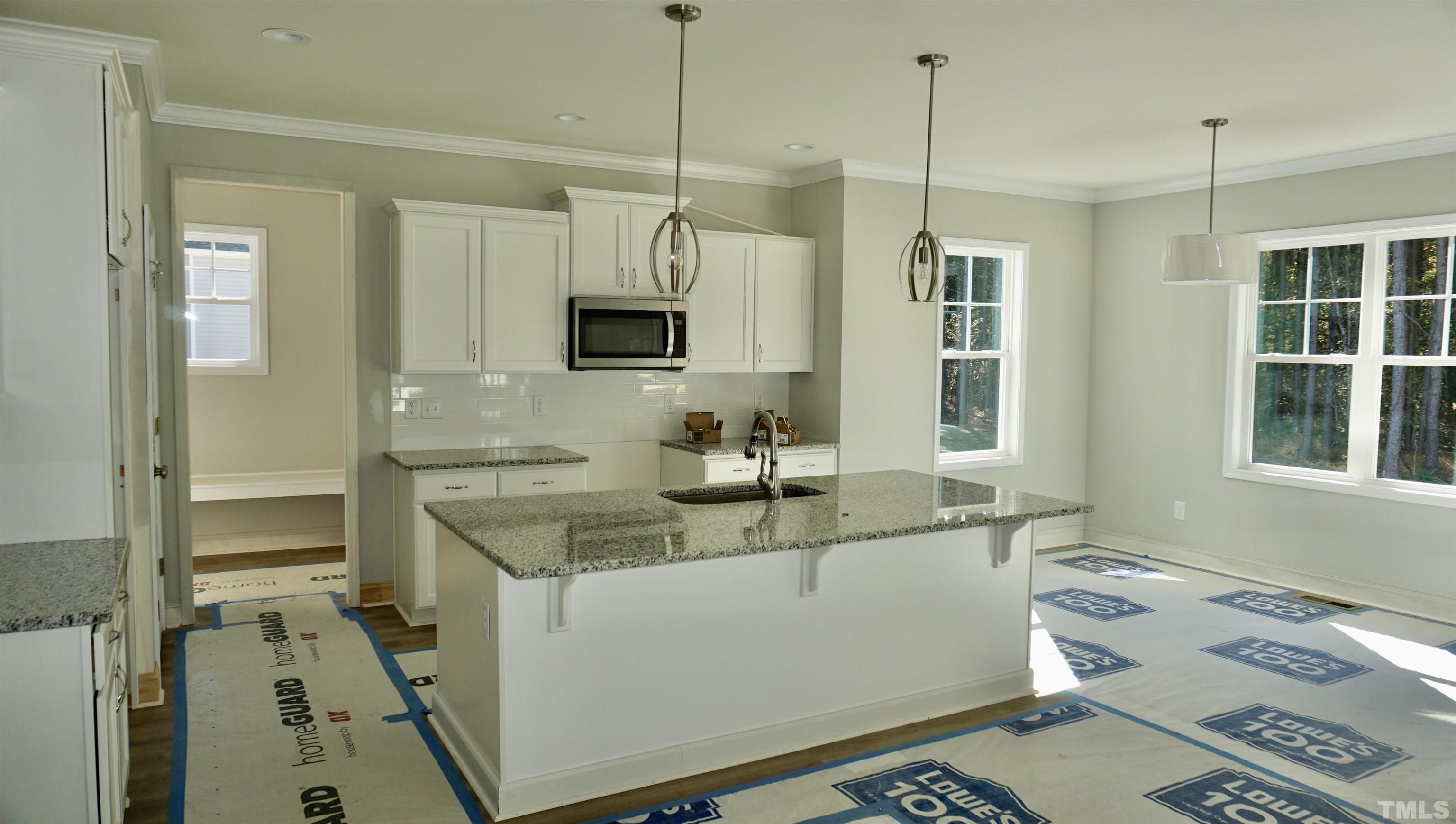 832 Mulberry Road Spring Hope, NC 27882 - Photo 10 of 26 a kitchen with a sink stove and refrigerator
