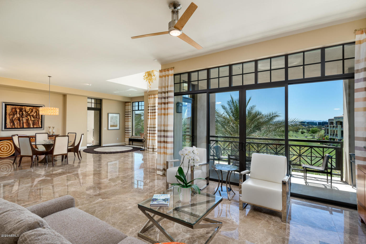 8 Biltmore Estate, Unit 302 Phoenix, AZ 85016 - Photo 1 of 21 a living room with furniture and a large window