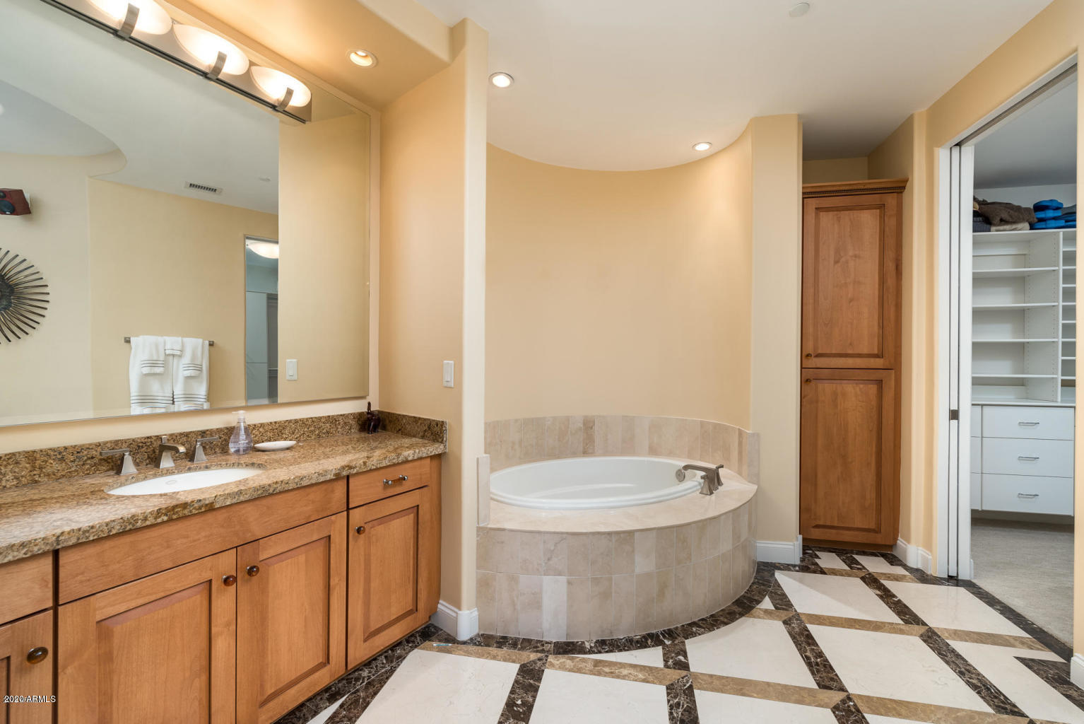 8 Biltmore Estate, Unit 302 Phoenix, AZ 85016 - Photo 11 of 21 a bathroom with a granite countertop sink toilet and shower