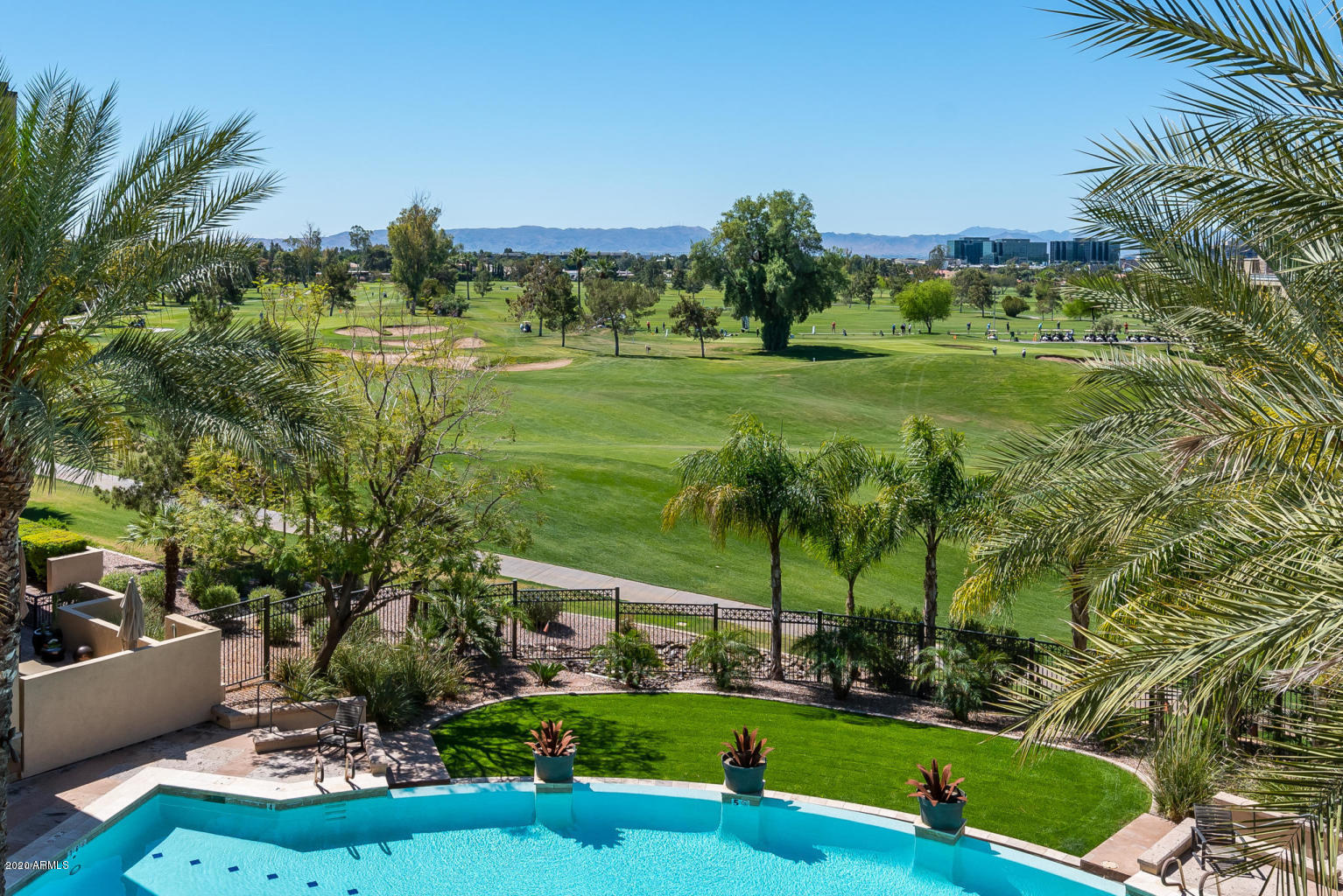 8 Biltmore Estate, Unit 302 Phoenix, AZ 85016 - Photo 16 of 21 a view of a garden with a building in the background