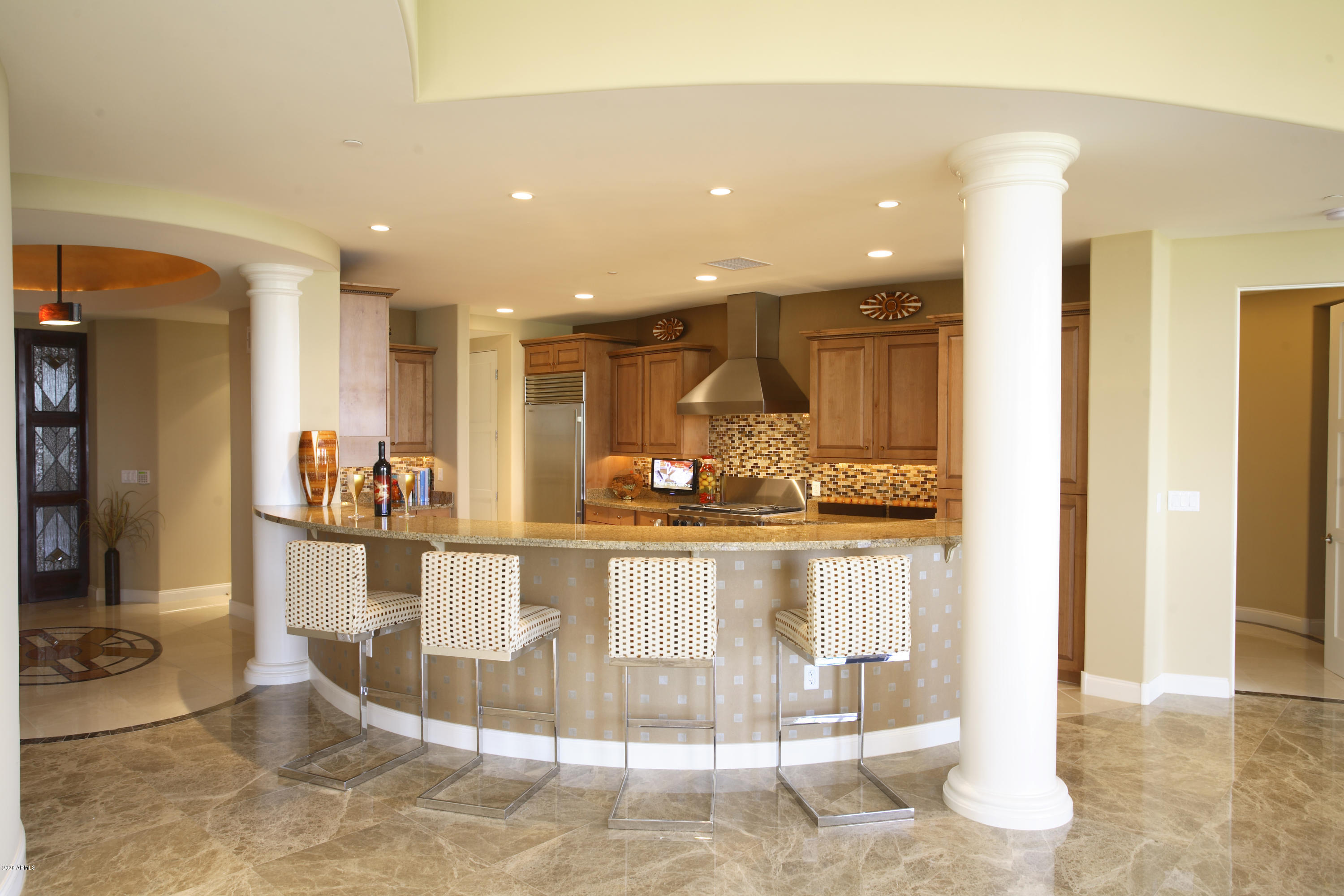 8 Biltmore Estate, Unit 302 Phoenix, AZ 85016 - Photo 4 of 21 a view of a kitchen and dining area