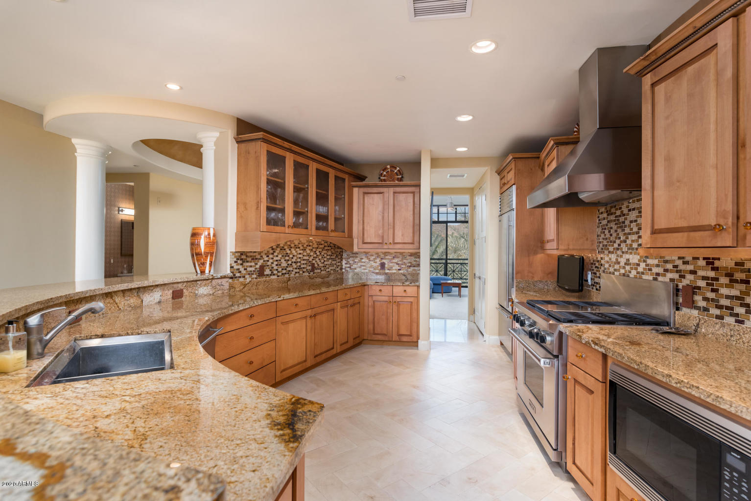 8 Biltmore Estate, Unit 302 Phoenix, AZ 85016 - Photo 5 of 21 a large kitchen with stainless steel appliances granite countertop a lot of counter space and a sink