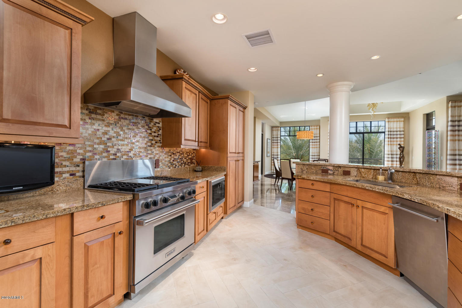 8 Biltmore Estate, Unit 302 Phoenix, AZ 85016 - Photo 6 of 21 a kitchen with stainless steel appliances granite countertop a stove a sink and a microwave