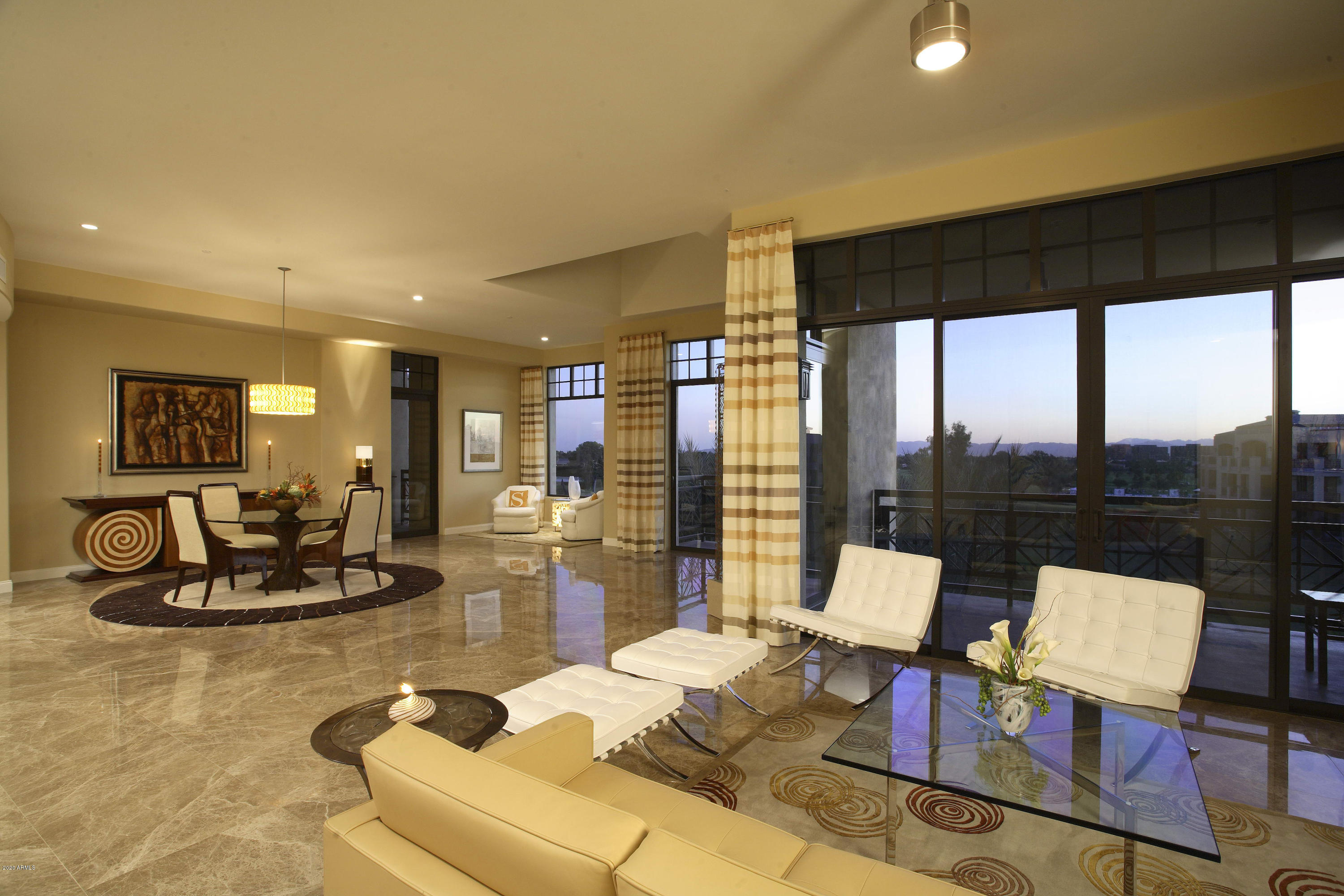 8 Biltmore Estate, Unit 302 Phoenix, AZ 85016 - Photo 9 of 21 a living room with furniture and a floor to ceiling window
