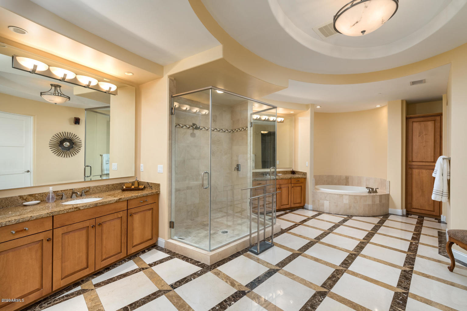 8 Biltmore Estate, Unit 302 Phoenix, AZ 85016 - Photo 10 of 21 a spacious bathroom with a mirror a shower and a sink