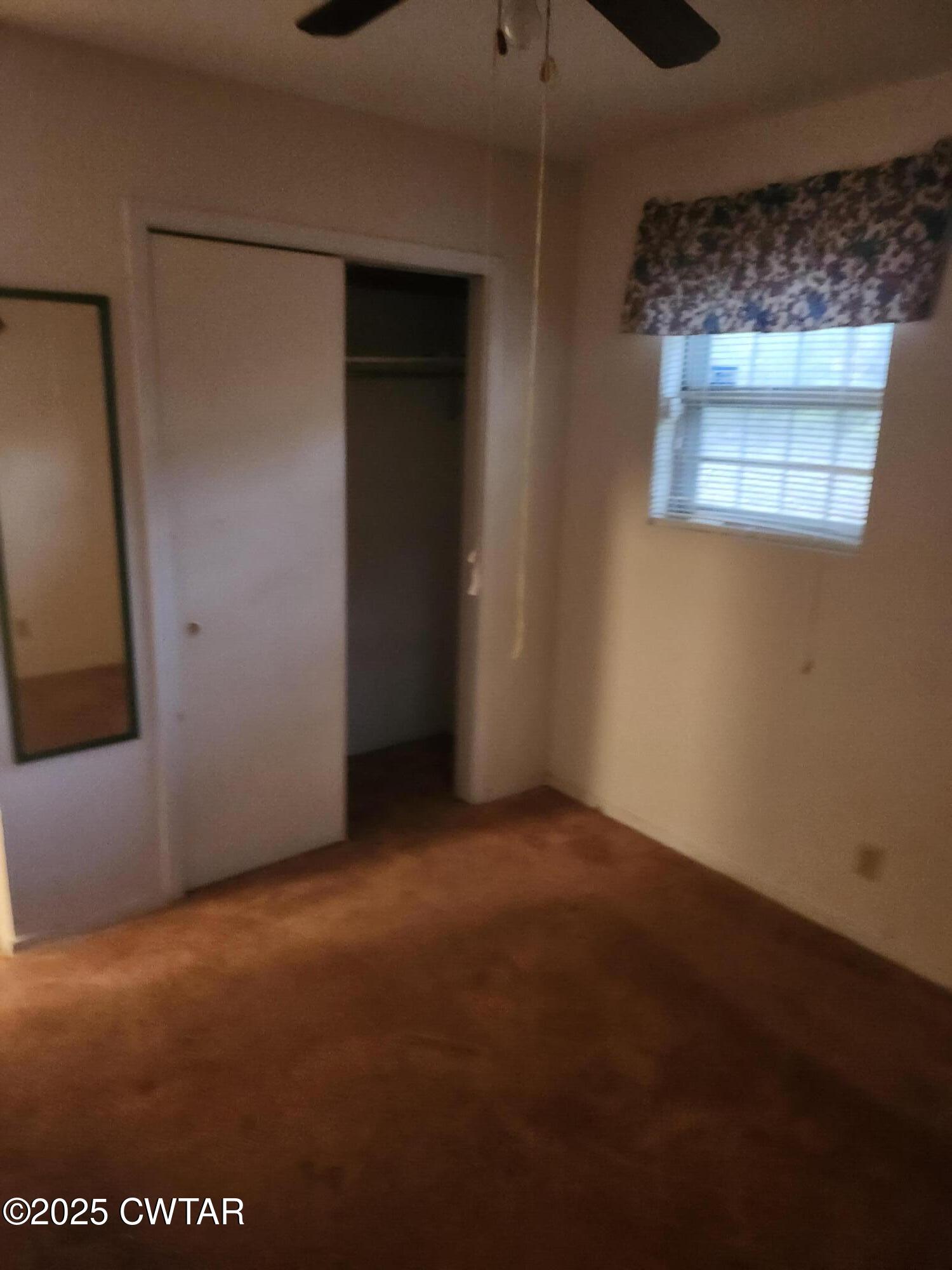 705 George Street Trenton, TN 38382 - Photo 13 of 15 an empty room with windows